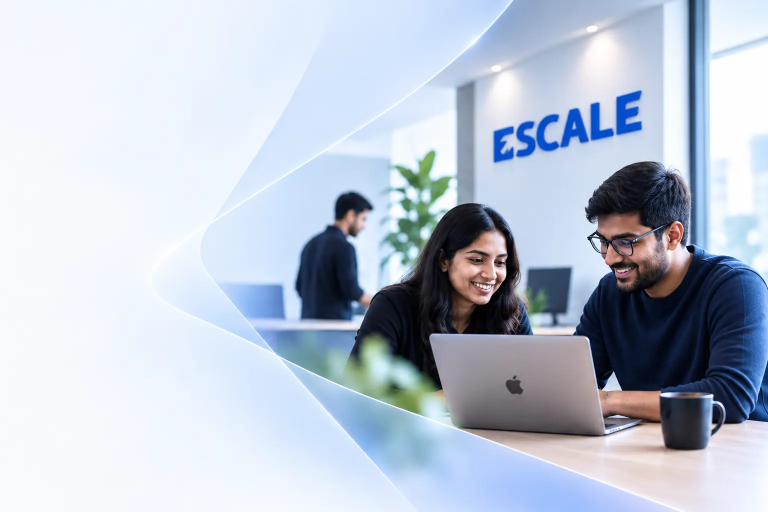 Escale team members collaborating in a modern workspace